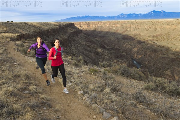 Hispanic runners training in remote area