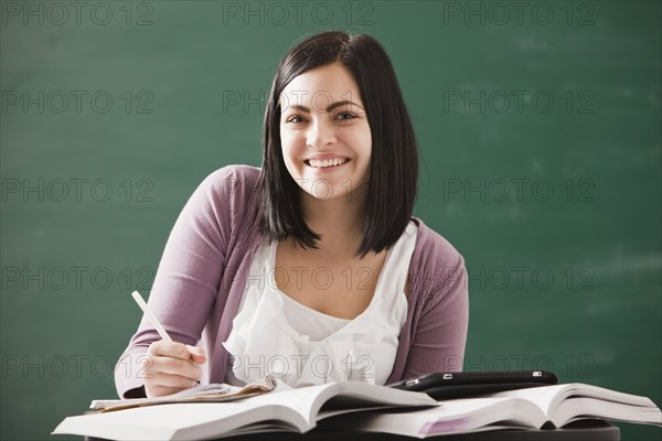 Caucasian student doing homework