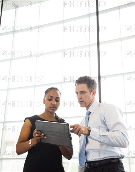 Business people using digital tablet
