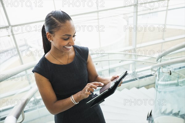 Indian businesswoman using digital tablet