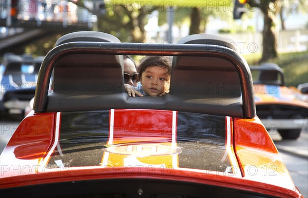 Child and parent in bumper car