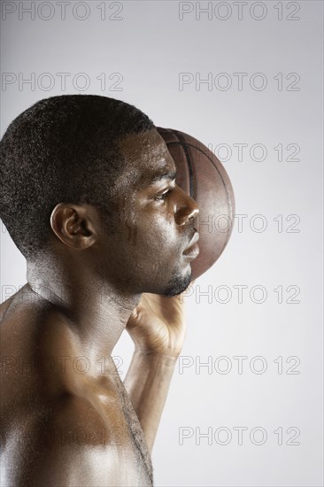 African basketball player holding basketball