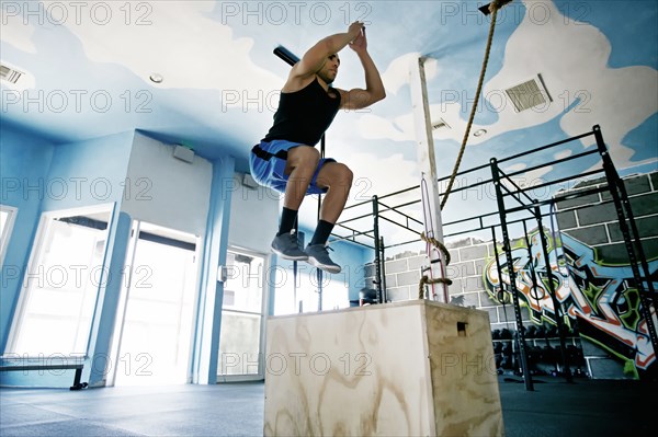 African American man exercising in gym