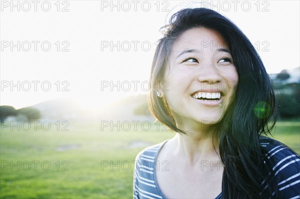 Chinese woman smiling outdoors