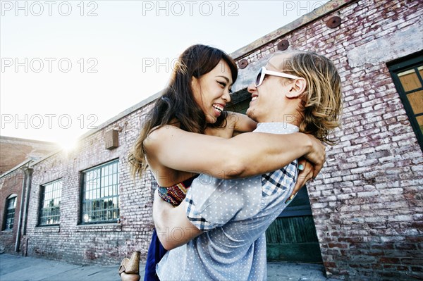 Couple hugging outdoors