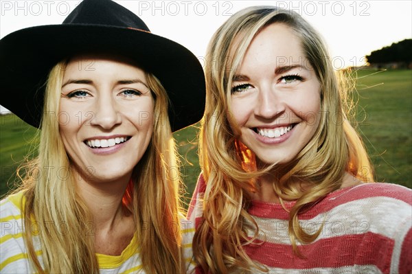 Caucasian women smiling in field