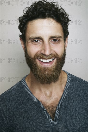 Smiling Caucasian man with beard looking at camera