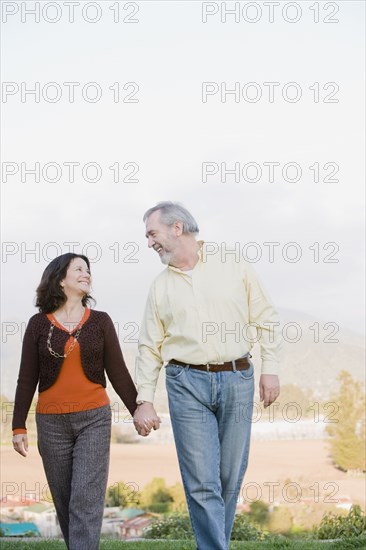 Hispanic couple holding hands