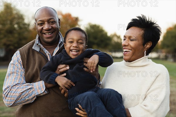 African American family playing in park