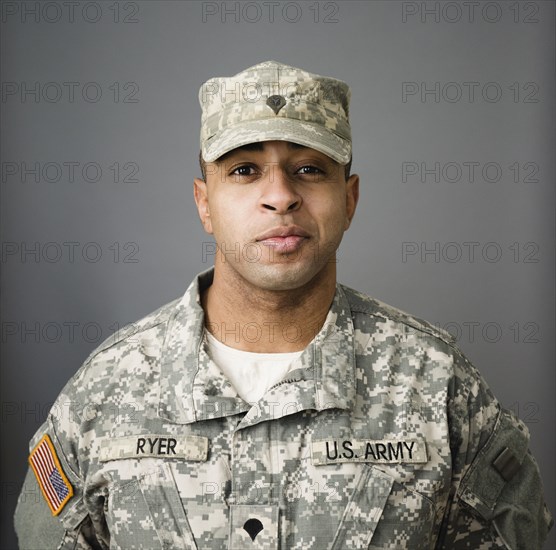 Close up of mixed race soldier smiling - Photo12-Tetra Images-Roberto ...