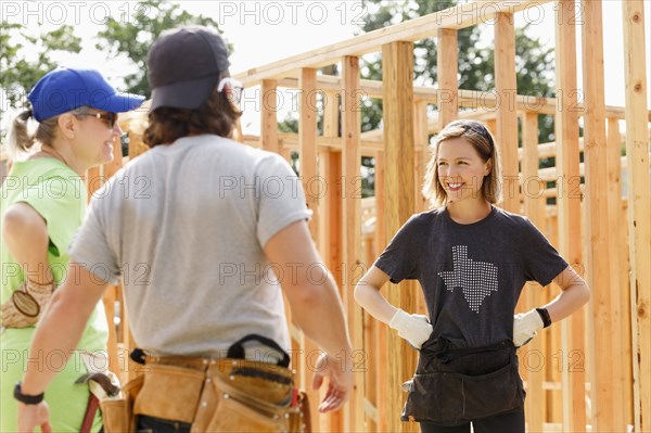 Caucasian volunteers standing at construction site