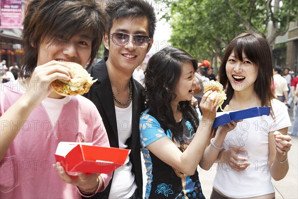 Chinese friends eating fast food together