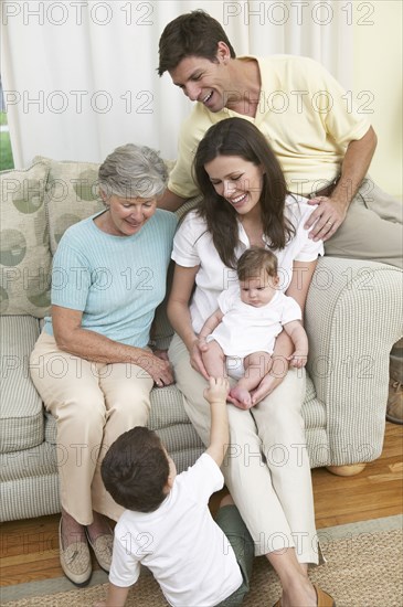 Family relaxing together on sofa