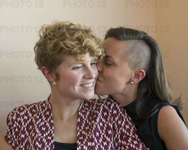 Caucasian lesbian couple kissing