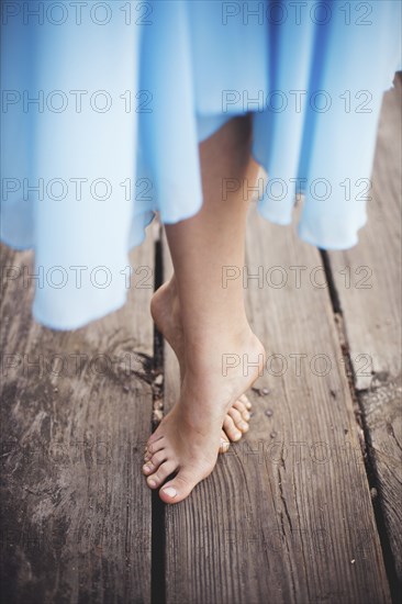 High angle view of girl standing on tip toe