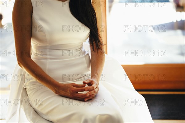 Close up of Korean bride sitting on bench