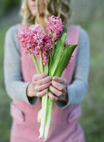 Close up of woman holding flower