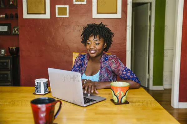 Black woman using laptop