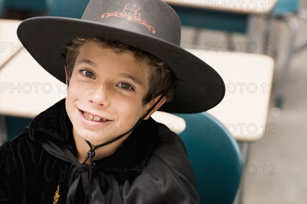 Close up portrait of mixed race boy in costume