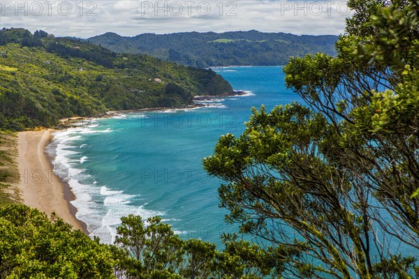 High angle view of beach and remote mountainside