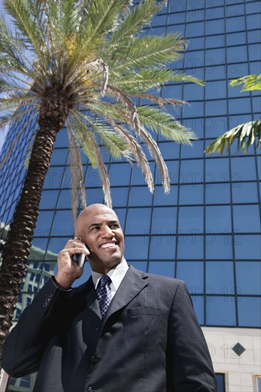 African businessman talking on cell phone