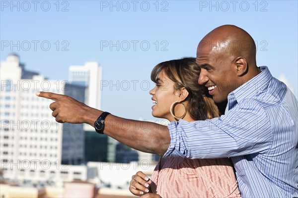 Man pointing to woman