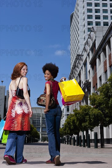 Women shopping together on city street