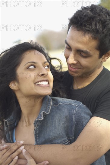 Portrait of couple smiling at each other