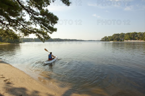 Man kayaking in lake