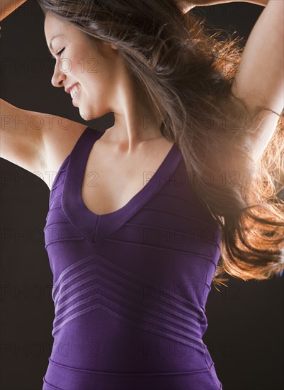 Mixed race woman dancing