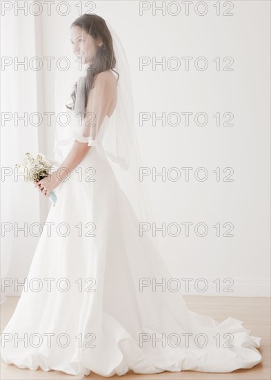 Mixed race bride in wedding dress