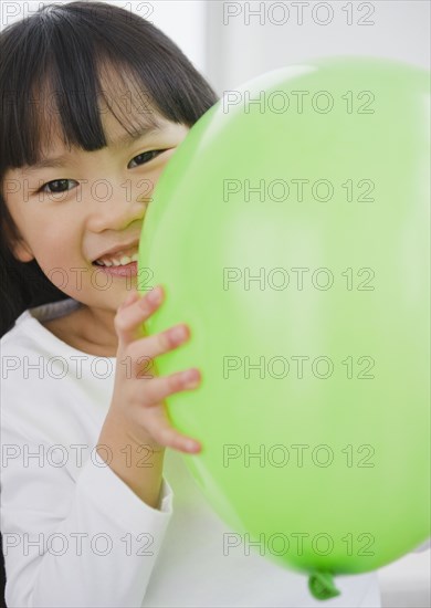 Chinese girl holding balloon