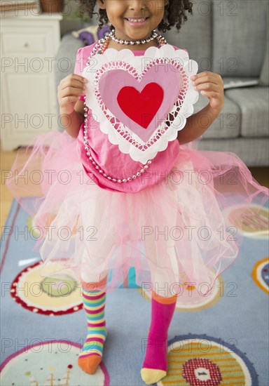 African American girl holding Valentine's Day card