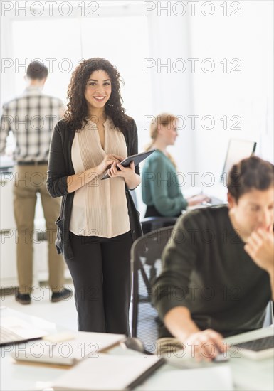 Businesswoman using digital tablet in office