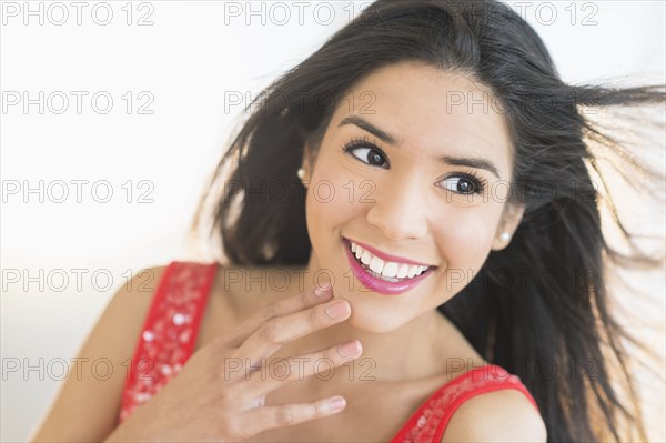 Close up portrait of smiling Hispanic woman