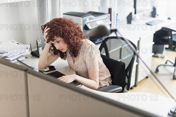 Hispanic businesswoman working in office