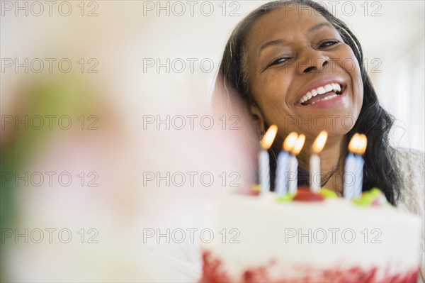 Mixed race woman celebrating birthday