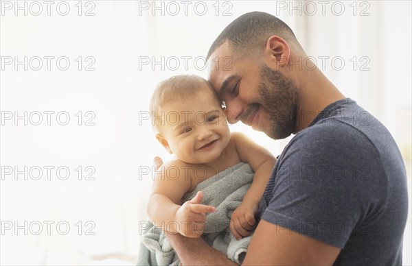 Father holding baby son