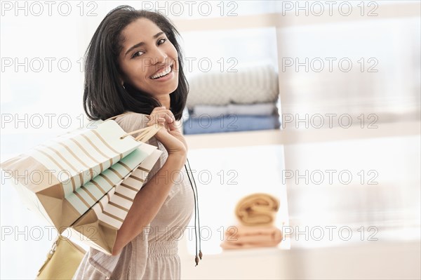 Hispanic woman carrying shopping bags