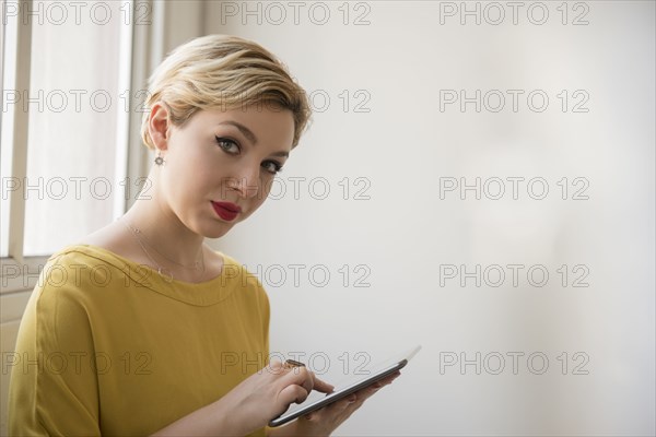 Caucasian woman using digital tablet