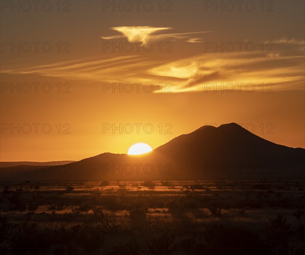 Sun setting above hill in Cerrillos Hills State Park - Photo12-Tetra ...