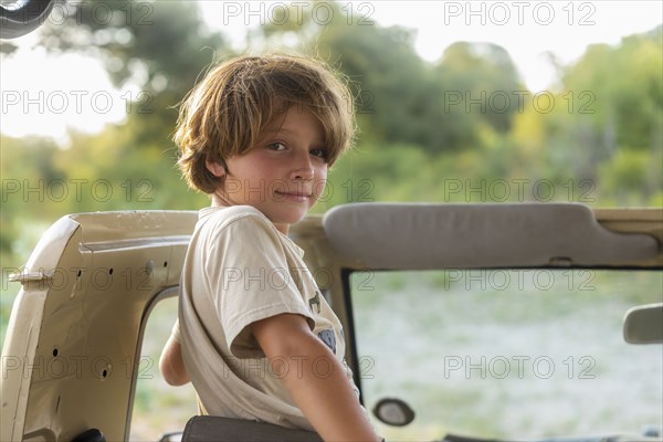 Portrait of Boy in safari vehicle