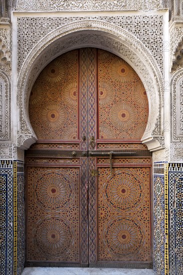 Traditionally decorated doors and tilework of mosque
