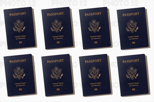 Rows of American passports on white background, New York, NY, USA