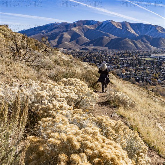 Rear view of woman hiking on Carbonate Mountain trail, Hailey, Idaho, USA