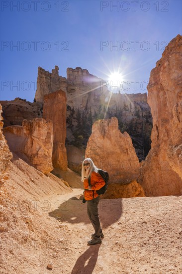 Portrait of smiling woman hiking in Bryce Canyon National Park on sunny day, , Utah, USA