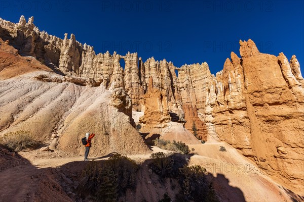 Woman taking pictures in Bryce Canyon National Park, , Utah, USA