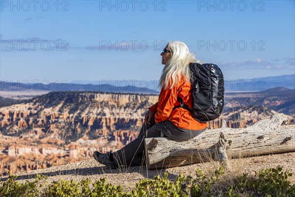 Senior woman with backpack looking at view in Bryce Canyon National Park, , Utah, USA