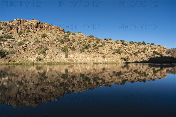 Usa, New Mexico, Abiquiu, Rio Chama, Hills reflected in Chama River, Abiquiu, New Mexico, USA