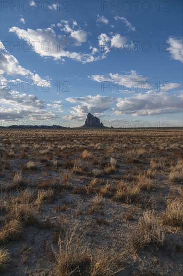 Usa, New Mexico, Shiprock, Clouds over desert landscape with Shiprock, Shiprock, New Mexico, USA